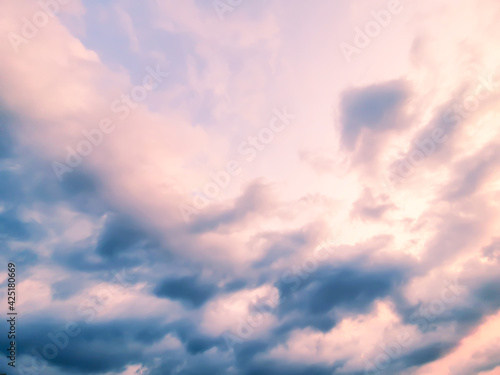 Blue and orange sky background with clouds in summer