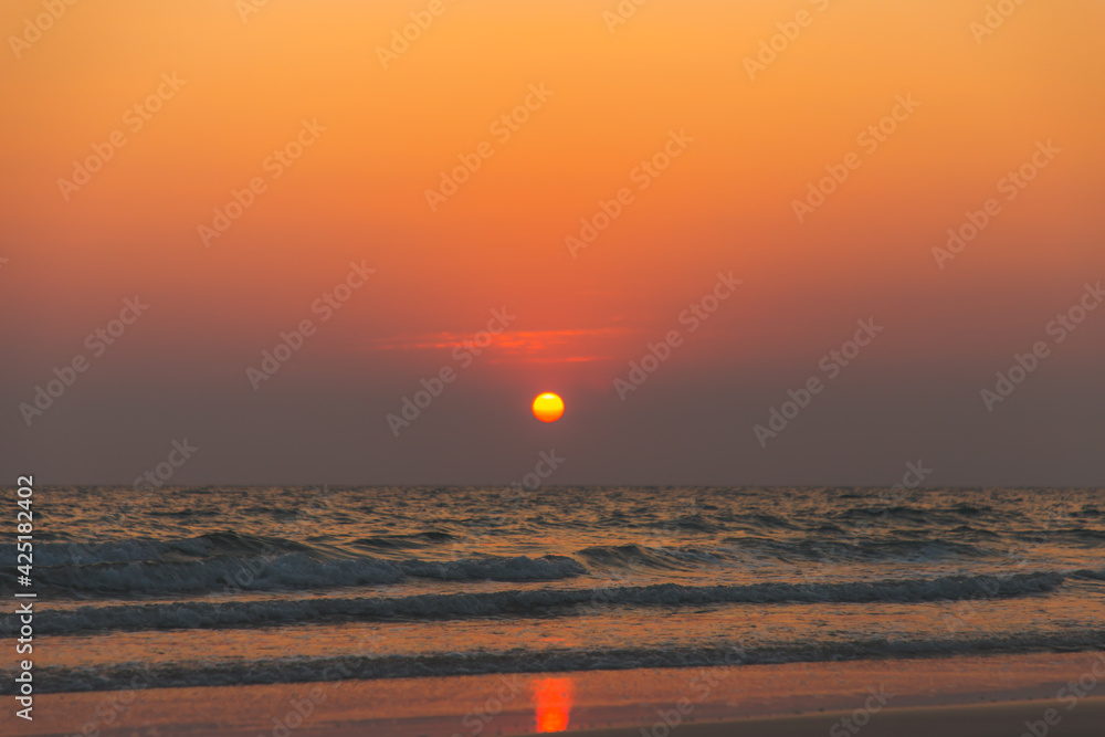 Nature in twilight period which including of sunset over the sea and the nice beach , Sunset and beach background