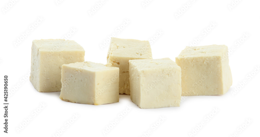 Pieces of delicious tofu on white background. Soybean curd