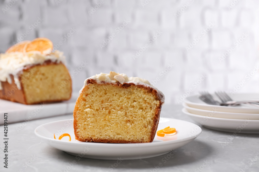 Cut delicious sweet cake on light grey marble table Cut delicious sweet cake on light grey marble table