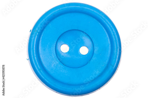 Old blue button isolated on white background
