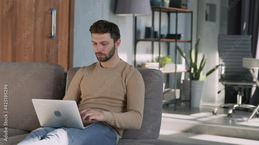 Young attractive man received good news on the internet Young attractive man received good news on the internet