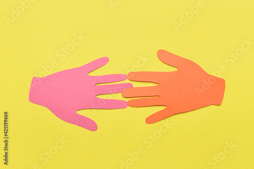 Paper human palms on color ...