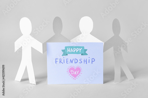 Paper human figures and gre...