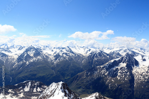 Mountain snow panorama on main chain of the Alps seen from summit Wildspitze and blue sky in Tyrol Alps  Austria