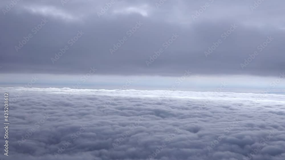 Beautiful blue sky above clouds with warm sunlight view from plane Beautiful blue sky above clouds with warm sunlight view from plane