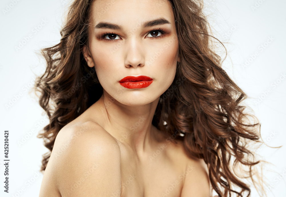 Woman brunette red lips shadows on eyelids portrait naked shoulders Woman brunette red lips shadows on eyelids portrait naked shoulders