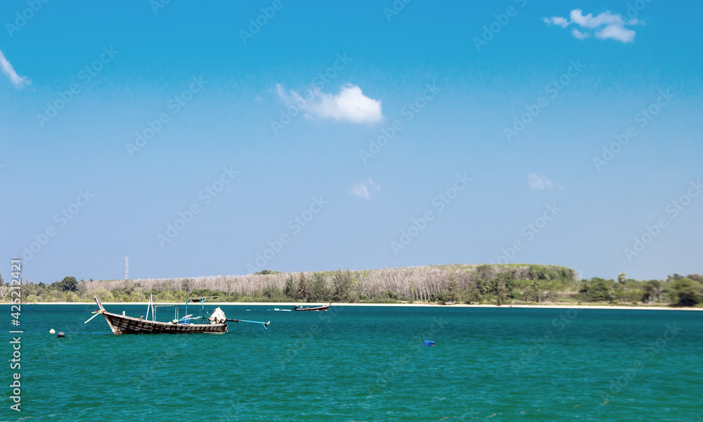 relax view with wood boat and clean sea in thailand