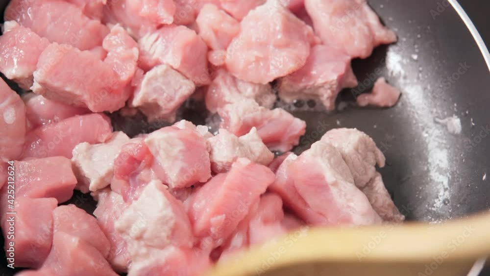 Meat in small pieces of goulash. Fried meat, food. close up selective focus Meat in small pieces of goulash. Fried meat, food. close up selective focus