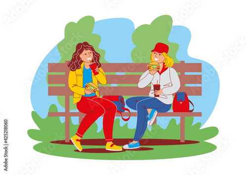 Two girls friends are sitting on a park bench, chatting and eating burgers. Street food, takeaway meal, outdoor recreation. Vector illustration, cartoon characters