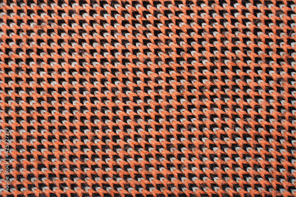 Red, white and black synthetic knitted fabric texture Red, white and black synthetic knitted fabric texture