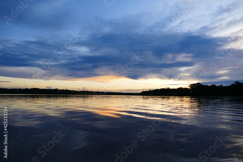 Tropical Amazon landscape  colorful sunset at the lake Mamori near Careiro in the amazon rainforest  state of Amazonas  Brazil.