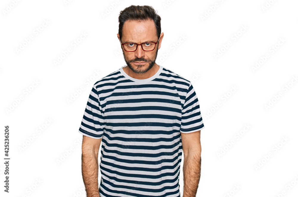 Middle age man wearing casual clothes and glasses skeptic and nervous, frowning upset because of problem. negative person. Middle age man wearing casual clothes and glasses skeptic and nervous, frowning upset because of problem. negative person.