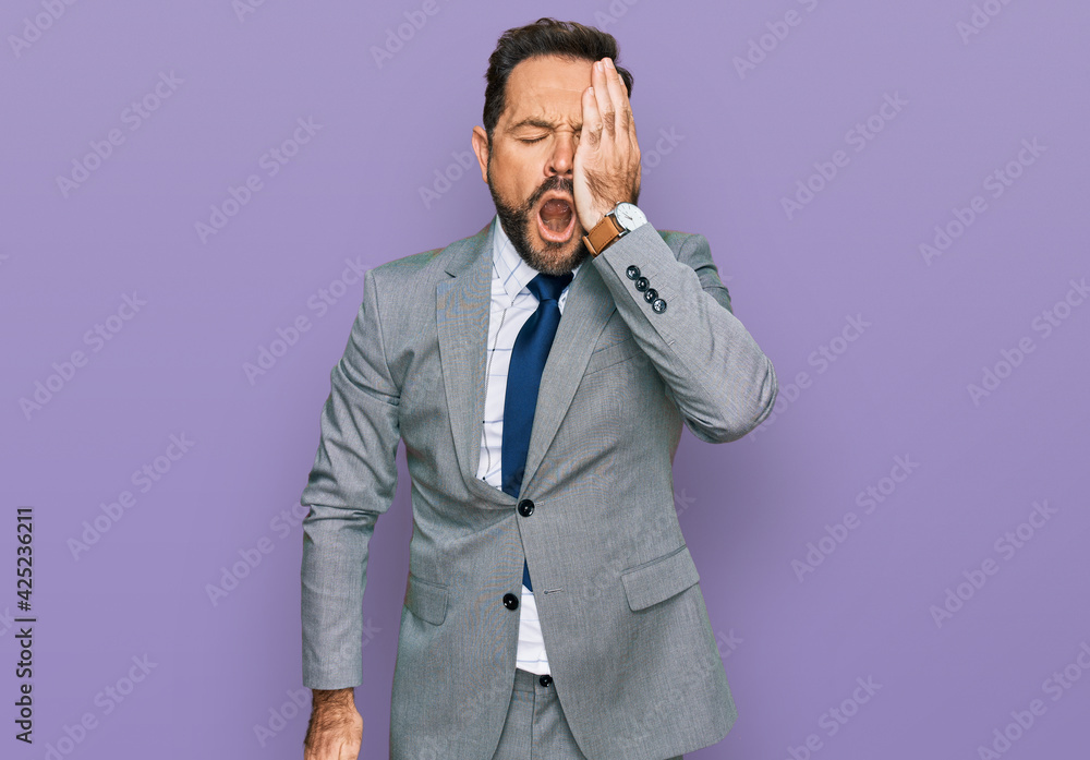 Middle age man wearing business clothes yawning tired covering half face, eye and mouth with hand. face hurts in pain. Middle age man wearing business clothes yawning tired covering half face, eye and mouth with hand. face hurts in pain.