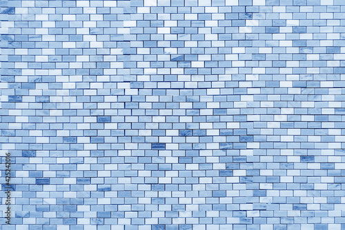 Small ceramic blue tiles. Beautiful decorative stone surface.