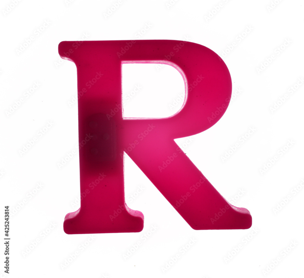 Plastic letter R on magnet isolated on white background, top view Plastic letter R on magnet isolated on white background, top view