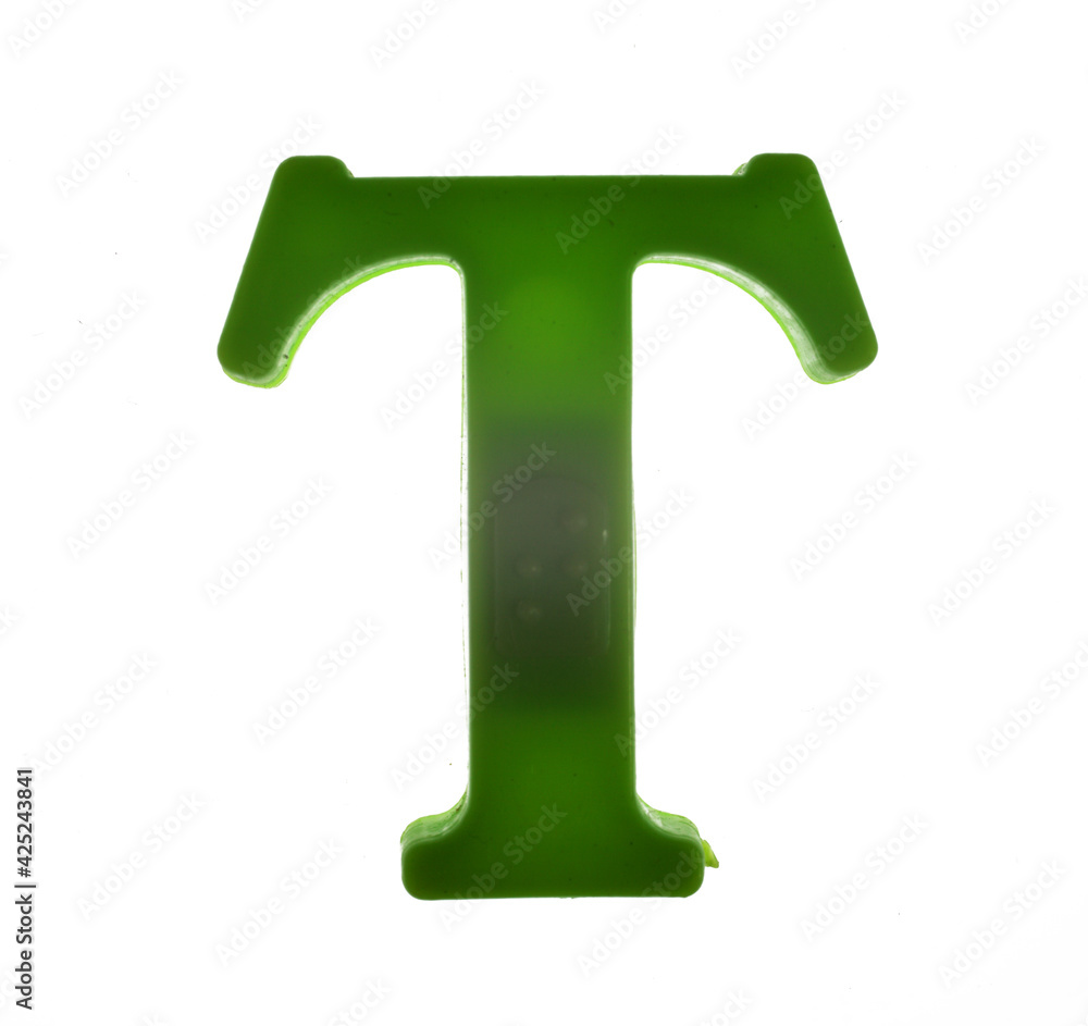 Plastic letter T on magnet isolated on white background, top view Plastic letter T on magnet isolated on white background, top view