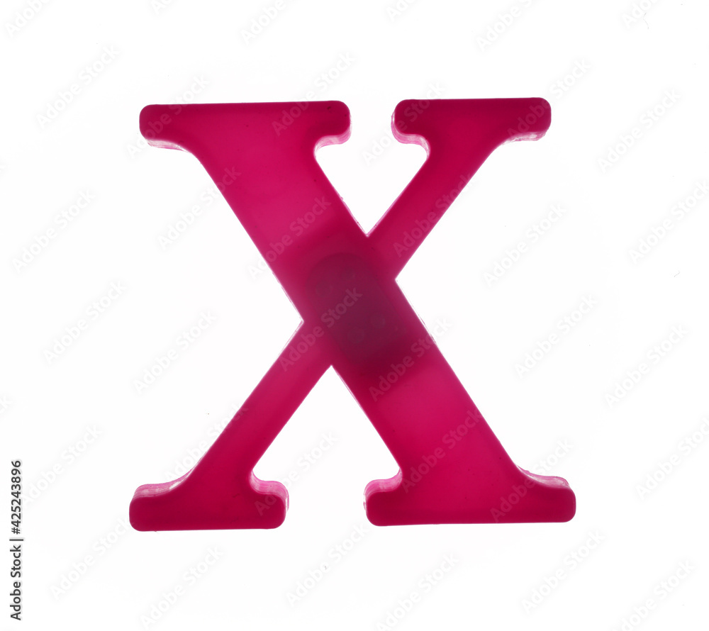 Plastic letter X on magnet isolated on white background, top view Plastic letter X on magnet isolated on white background, top view