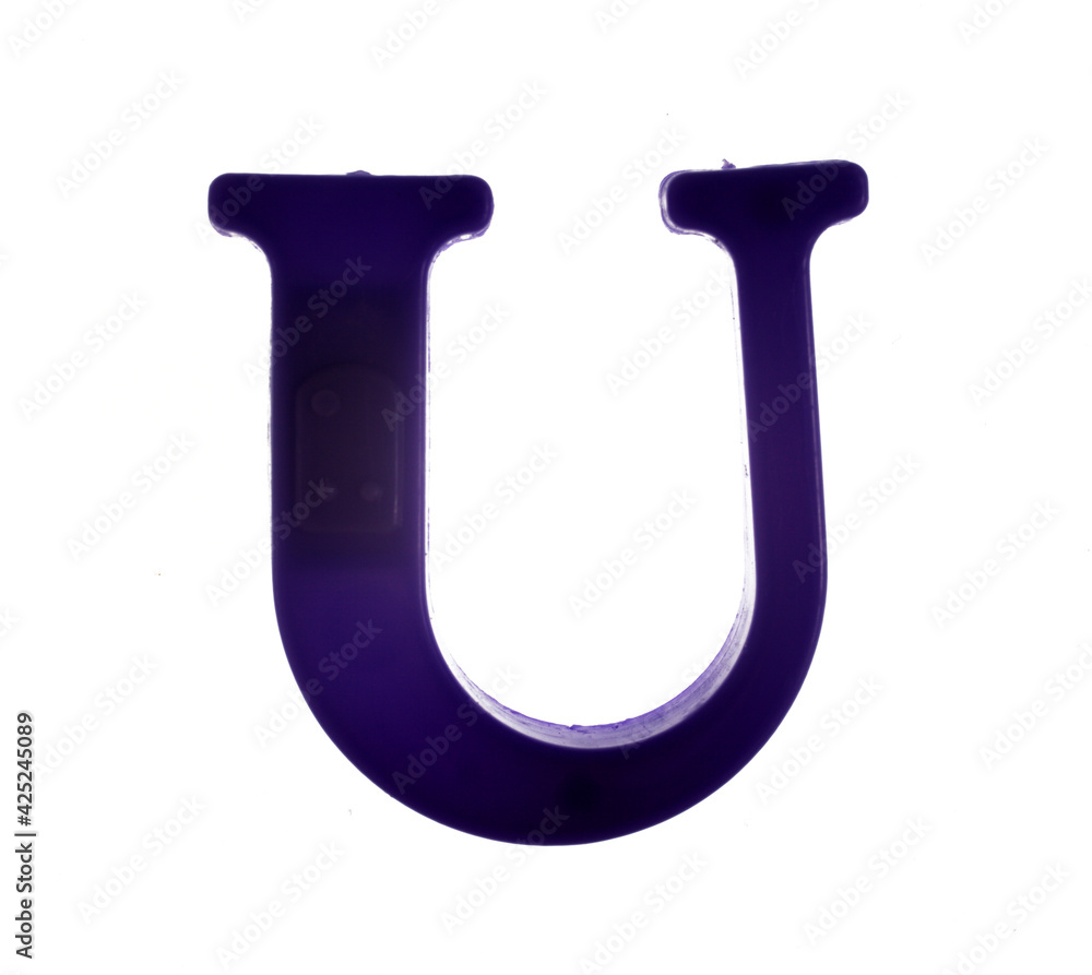 Plastic letter U on magnet isolated on white background, top view Plastic letter U on magnet isolated on white background, top view