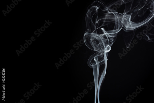 Movement of abstract smoke on a black background. Selective focus. Overlay layer