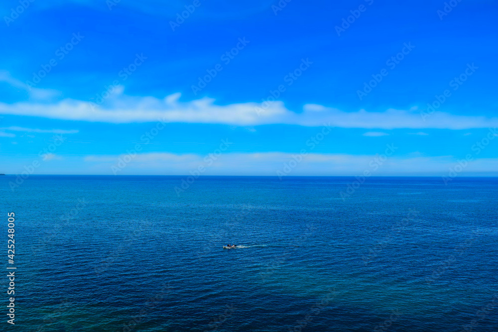 Beautiful view of a wooden boat on open Mediterranean sea 