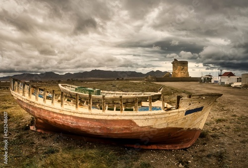 wrecked fishing boats at San Miguel beach, Cabo de Gata, Almeria province, Andalusia, Spain