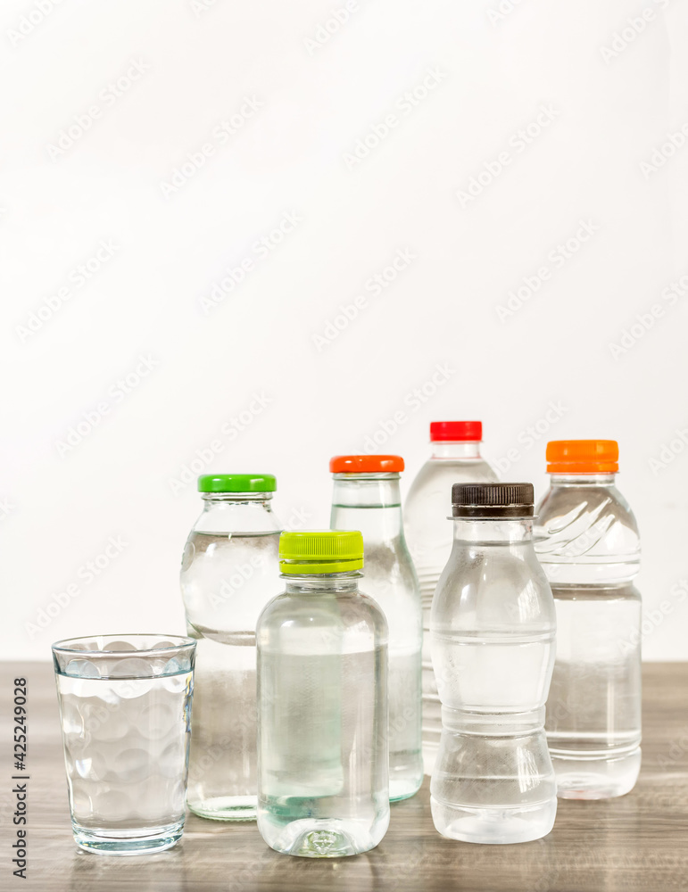 Several bottles of water on wooden table. Several bottles of water on wooden table.