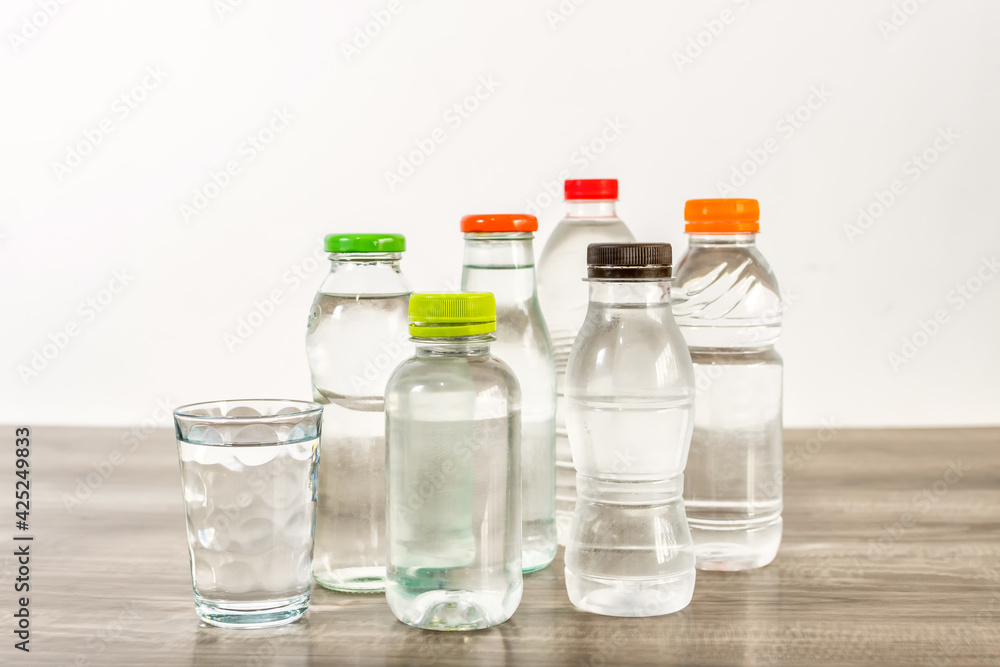 Several bottles of water on wooden table. Several bottles of water on wooden table.