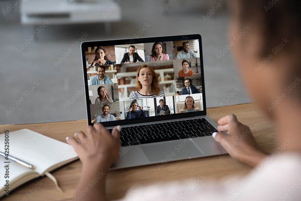 Φωτογραφία Rear view of African American female employee have webcam digital online conference with diverse colleagues on laptop