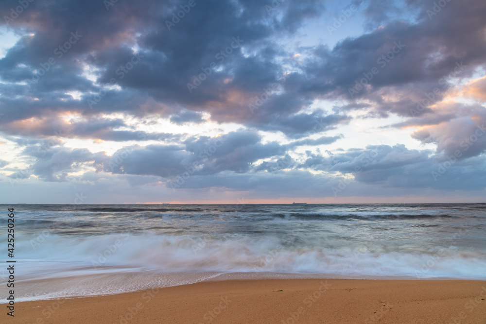 Sunrise at the seaside with a cloudy sky Sunrise at the seaside with a cloudy sky