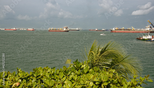   View of the Singapore Strait from the Siloso Beach of Sentosa Island photo