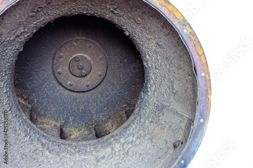 dirty impeller of a low pressure centrifugal fan in a large supply and exhaust system, the foreground and background are blurred with a bokeh effect
