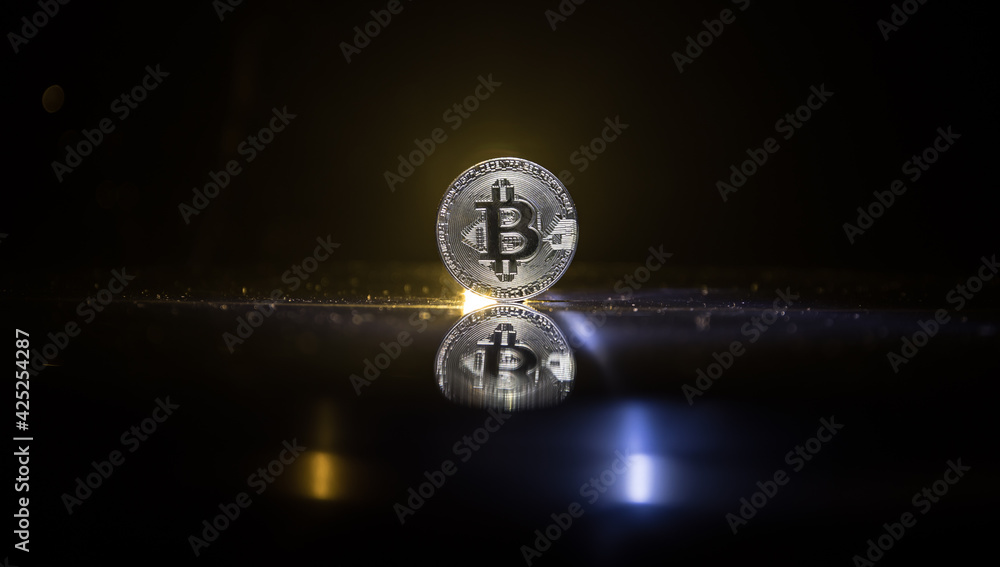 Golden Bitcoin on dark backround. New virtual money. Crypto currency Golden Bitcoin on dark backround. New virtual money. Crypto currency