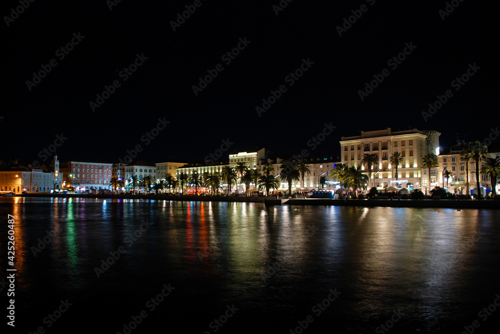 Old town of Split by night, Dalmatia, Croatia. Panorama. Palace of Diocletian and Riva promenade.