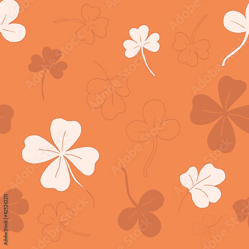 Seamless pattern with clover. The leaves of the clover. Orange pattern. Lots of clover leaves. Vector illustration. Stock vector.