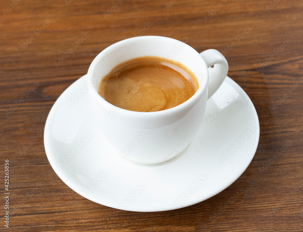 cup of coffee on wooden table cup of coffee on wooden table