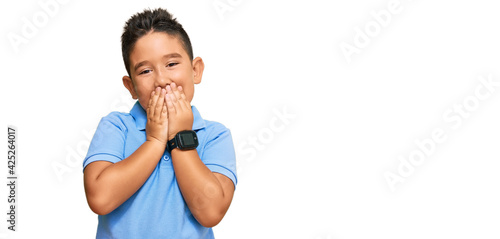 Schilderij op canvas Little boy hispanic kid wearing casual clothes laughing and embarrassed giggle c