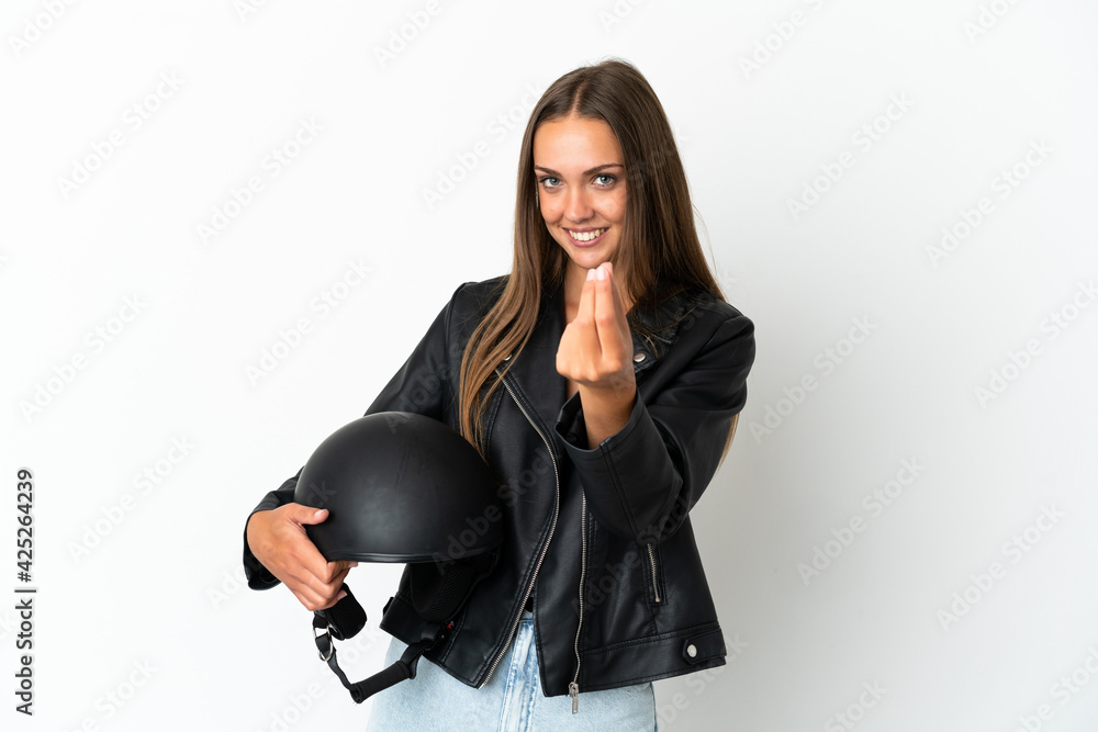 Woman with a motorcycle helmet over isolated white background making money gesture Woman with a motorcycle helmet over isolated white background making money gesture