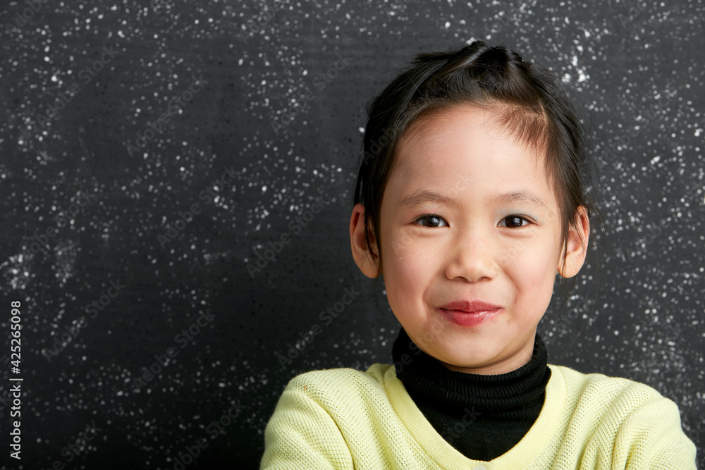 Asian little girl doing makeup on herself in fun Asian little girl doing makeup on herself in fun