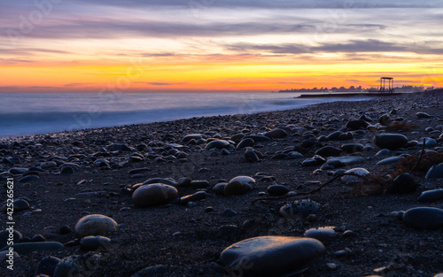 sunset over the seaa nd beach photo