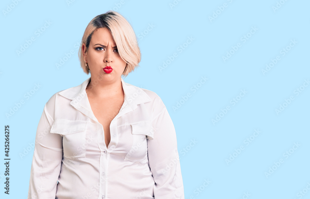 Young blonde plus size woman wearing casual shirt depressed and worry for distress, crying angry and afraid. sad expression. Young blonde plus size woman wearing casual shirt depressed and worry for distress, crying angry and afraid. sad expression.
