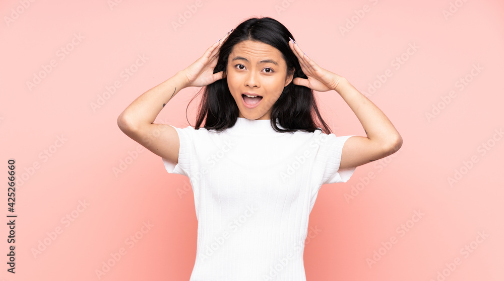Teenager Chinese woman isolated on pink background with surprise expression Teenager Chinese woman isolated on pink background with surprise expression