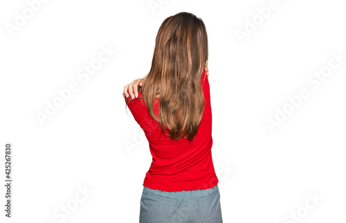 Young brunette woman wearing casual clothes hugging oneself happy and positive from backwards. self love and self care