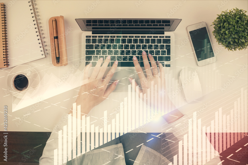Double exposure of woman hands working on computer and forex chart hologram drawing. Top View. Financial analysis concept. Double exposure of woman hands working on computer and forex chart hologram drawing. Top View. Financial analysis concept.