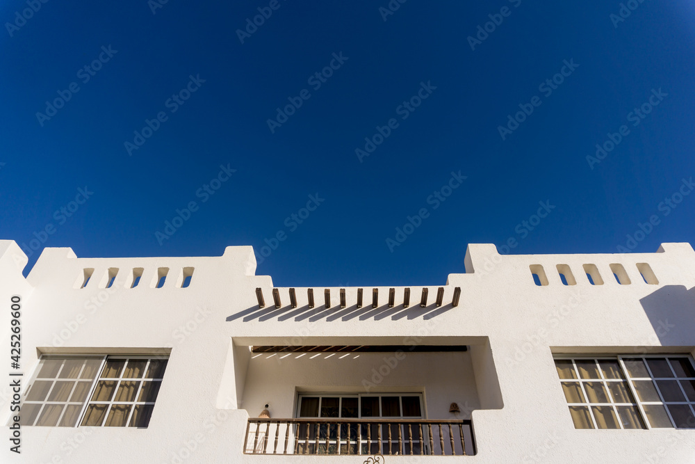 Obraz premium The view of top floor of house in the tropical garden with balcony and roof