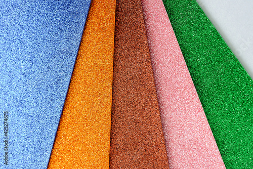 Multicolored material with metallic sheen. Samples of metal painting with glossy paint