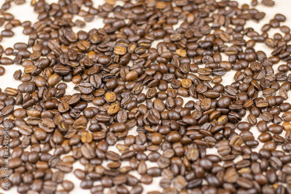 Coffee beans are scattered on the table. Coffee beans are scattered on the table.