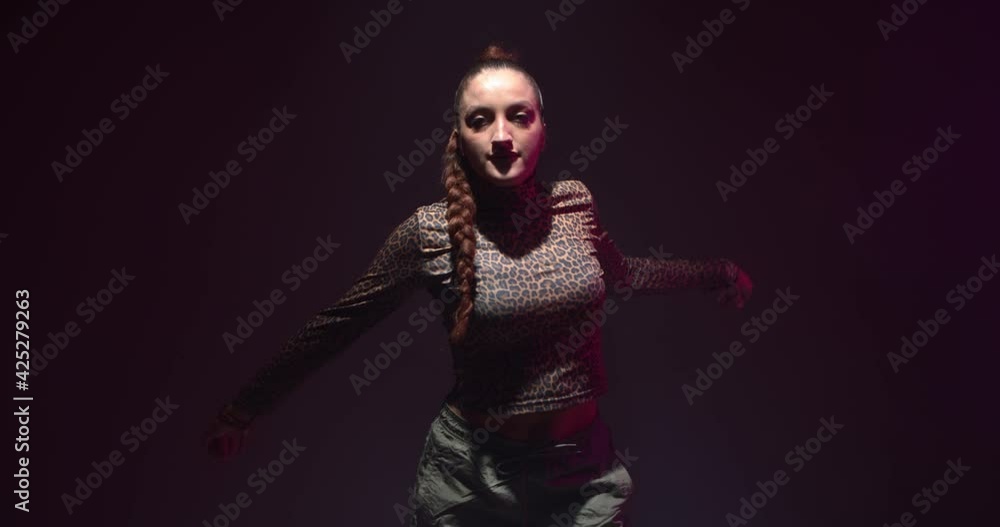 Ethnic african female modern dance. Cool dancing young girl performing in studio. Rhythm and passion concept Ethnic african female modern dance. Cool dancing young girl performing in studio. Rhythm and passion concept