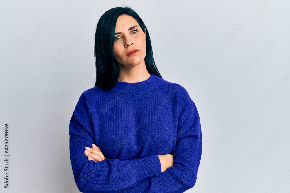 Young caucasian woman wearing casual clothes relaxed with serious expression on face. simple and natural looking at the camera. Young caucasian woman wearing casual clothes relaxed with serious expression on face. simple and natural looking at the camera.
