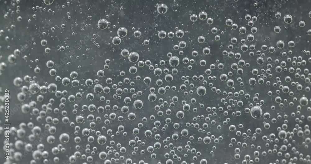 Blurry water texture with bubbles circulating Blurry water texture with bubbles circulating